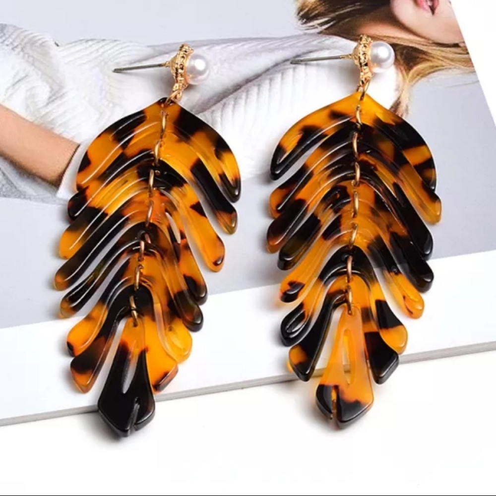 Acrylic earrings with pearl stud.